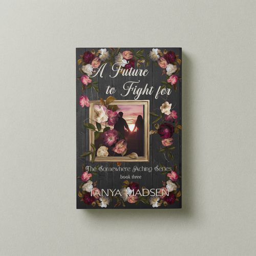 A front‑facing image of the book A Future to Fight For, surrounded by a floral design. The cover shows a silhouette of a couple holding hands staring at the sunrise. The book is set against a sage‑green background.