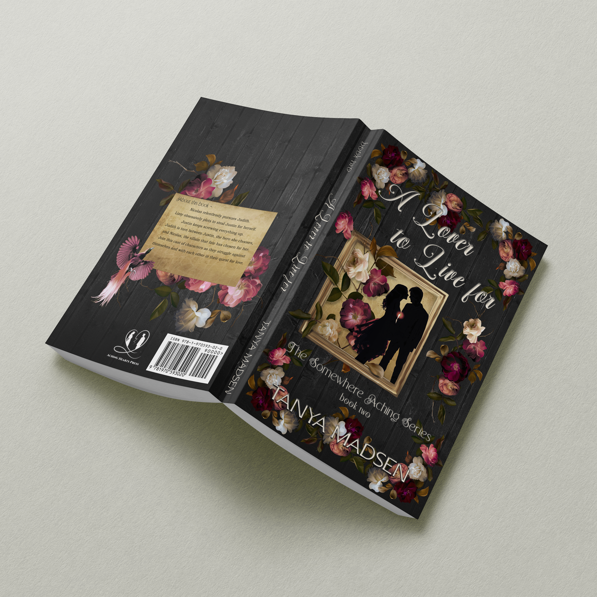 A flat‑lay image of the back cover of A Lover to live for For, featuring a floral design surrounding a silhouette of a couple almost kissing. The book rests on a sage‑green background, showing the full back cover and spine.