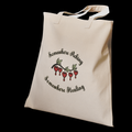 A canvas tote illustrated with the quote “Somewhere Aching, Somewhere Healing” paired with a cluster of bleeding hearts.