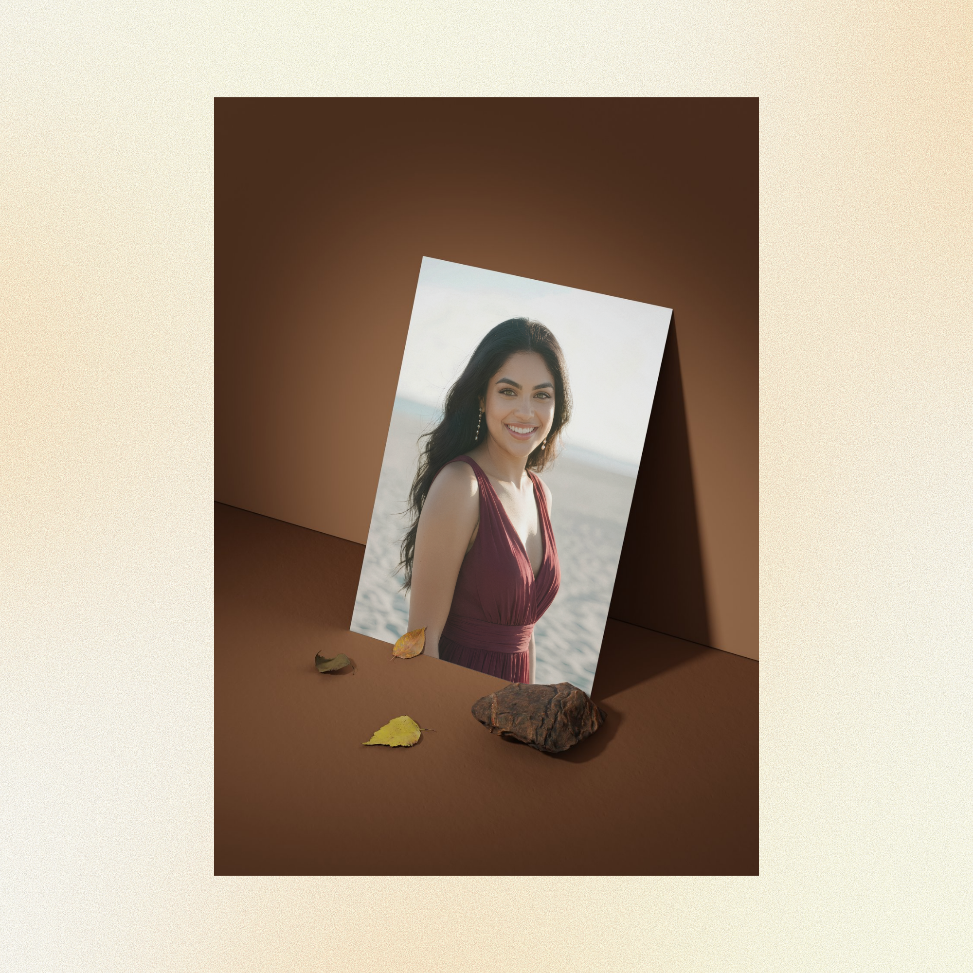 A photo of Judith displayed against a brown wall, smiling at the camera with green eyes, wearing a burgundy dress.