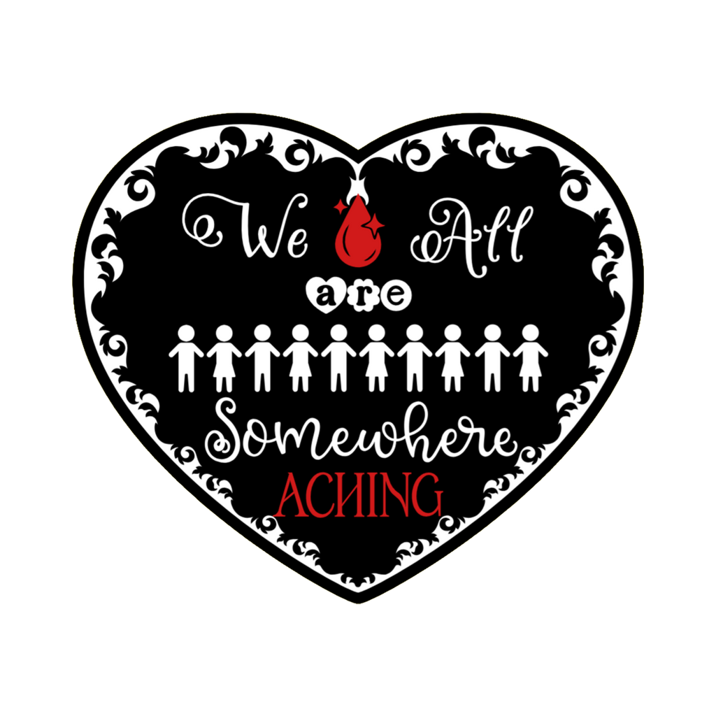 A 3x3 glossy vinyl black heart sticker features the “We Are All Somewhere Aching” series theme in a black‑white‑red design.