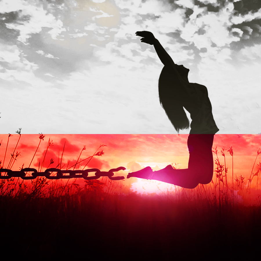 Silhouette of a person breaking free from chains against a sunset sky.