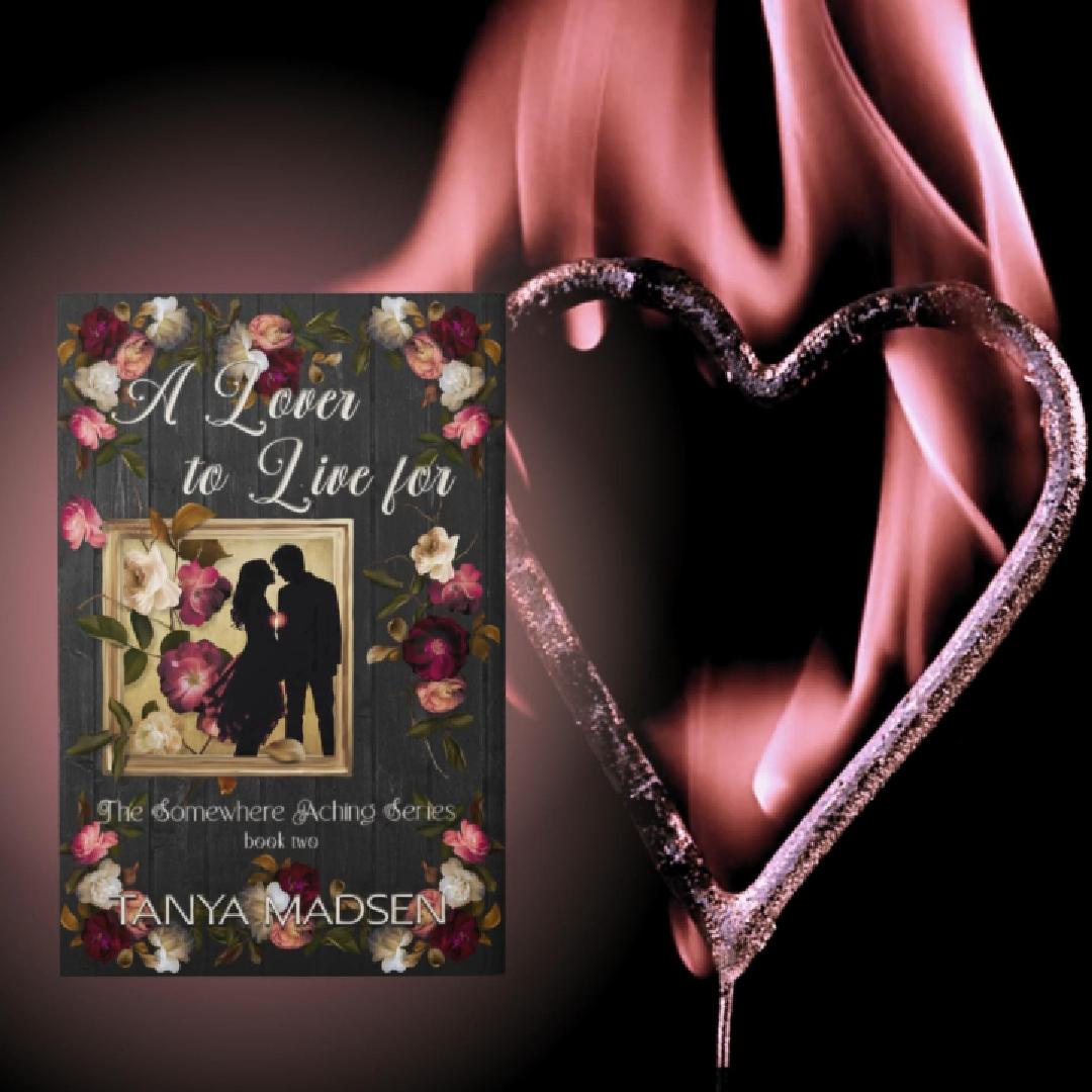 A short video showing the front cover of A Lover to Live For, featuring a silhouette of a couple leaning in for a kiss surrounded by floral elements. Beside the book lies a metallic pink heart on a black background that ignites into soft pink flames.