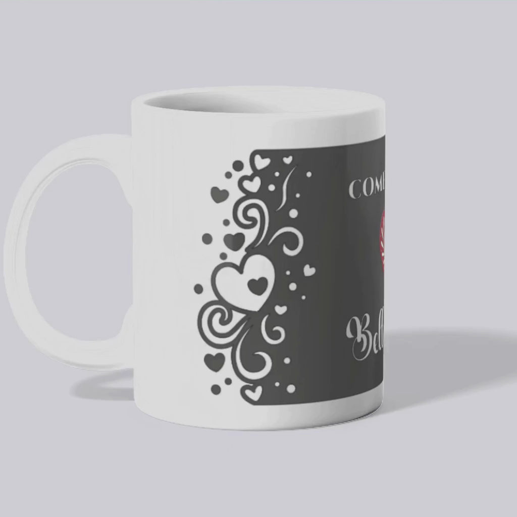A mockup of the Belladonna mug featuring a black mug with a red heart, text 'Come with me Belladonna', and black border with white hearts and swirls.
